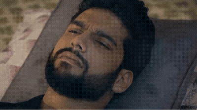 Bearded Man Laying On Bed Eyes Closed GIF
