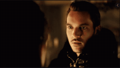 Bearded Man Looking At Another Man In Dark Room GIF