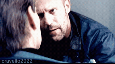 Bearded Man Looking At Another Man's Face 2022 GIF