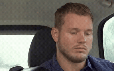 Bearded Man Looking At Camera From Back Seat GIF
