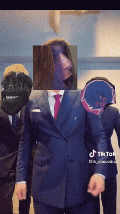 Bearded Man Looking At Camera In Car With Others GIF