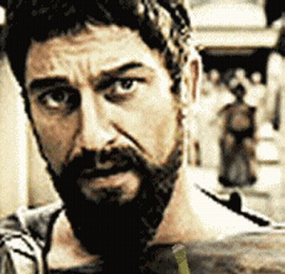 Bearded Man Looking At Camera With Crowd GIF