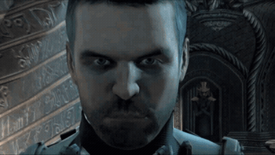 Bearded Man Looking At Camera With X On Wall GIF