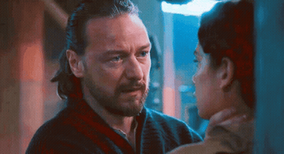 Bearded Man Looking At Woman With Ponytail GIF