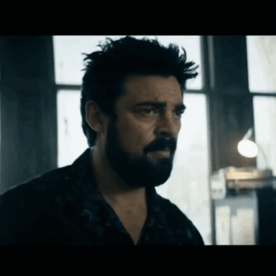 Bearded Man Looking In Dark Room GIF