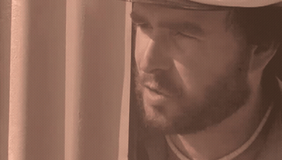 Bearded Man Looking Out Window With Mouth Open GIF