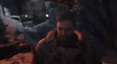 Bearded Man Lying On Ground In Video Game GIF