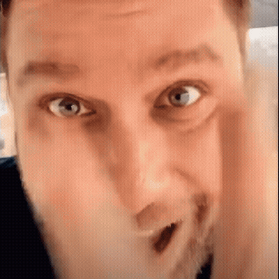 Bearded Man Making Funny Face Hand To Face GIF