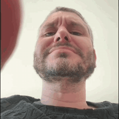 Bearded Man Making Funny Face In Black Sweater GIF