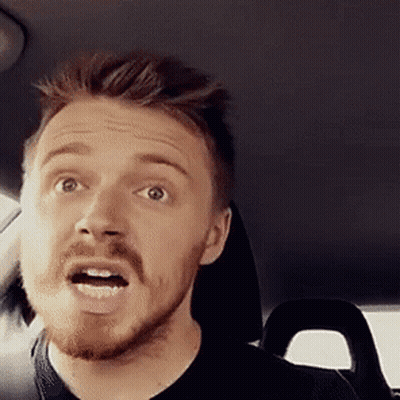 Bearded Man Making Funny Face In Car Back Seat GIF