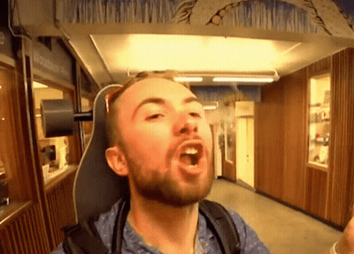 Bearded Man Making Funny Face In Chair GIF