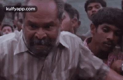 Bearded Man Making Funny Face in Crowd