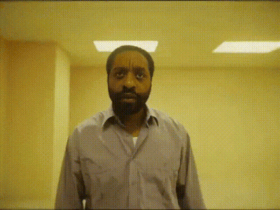 Bearded Man Making Funny Face In Hallway GIF