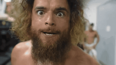 Bearded Man Making Funny Face In Locker Room GIF