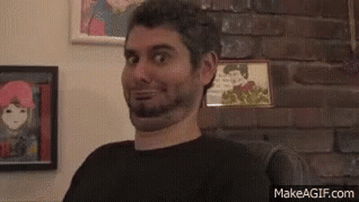 Bearded Man Making Funny Face On Couch GIF