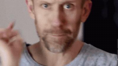 Bearded Man Making Funny Face Pointing At Camera GIF