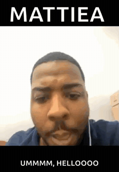 Bearded Man Making Funny Face With Earbuds In Black Shirt GIF