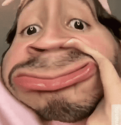 Bearded Man Making Funny Face With Hand On Face GIF