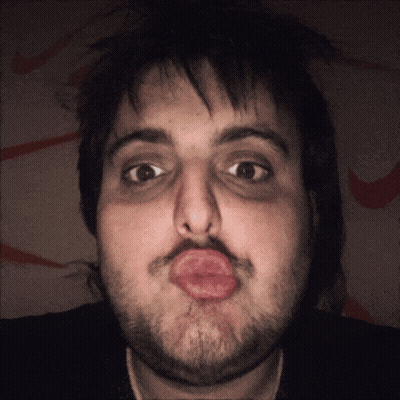 Bearded Man Making Funny Face With Lips GIF