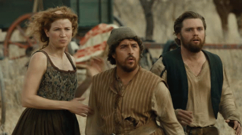 Bearded Man Next To Red Haired Woman GIF