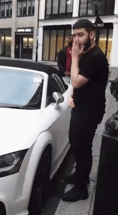Bearded Man Next To White Sports Car GIF