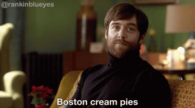 Bearded Man On Couch Saying Boston Cream Pies GIF