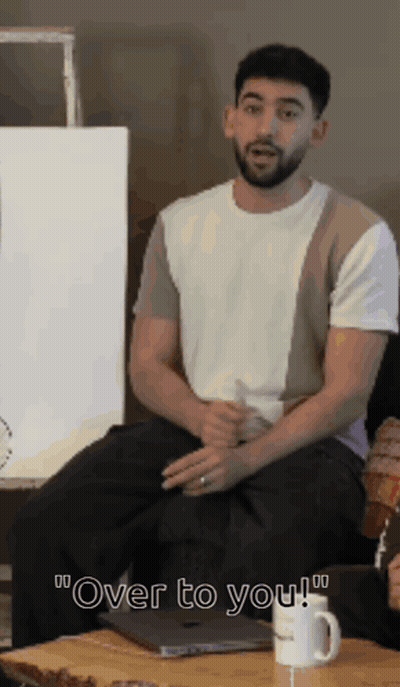 Bearded Man On Couch Saying Over To You GIF