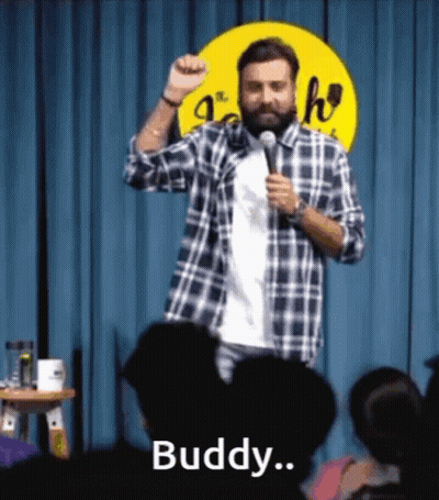 Bearded Man On Stage Holding Microphone GIF