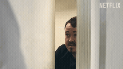 Bearded Man Peeking Through Door GIF