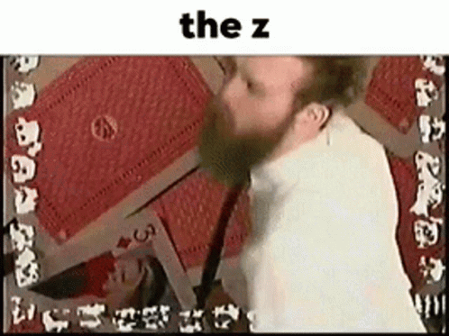 Bearded Man Playing Cards With Card Saying The Z GIF