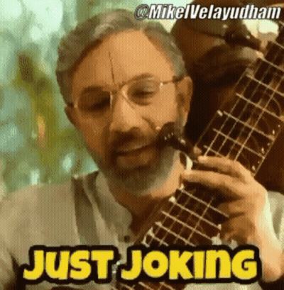 Bearded Man Playing Guitar Saying Just Joking GIF
