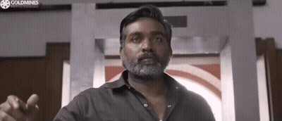 Bearded Man Pointing At Window GIF