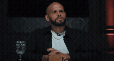 Bearded Man Pointing In Chair GIF
