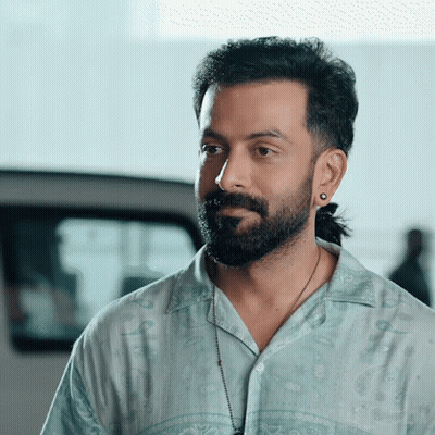 Bearded Man Ponytail Blue Shirt GIF