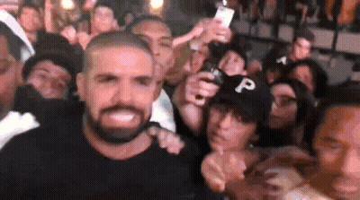 Bearded Man Posing With Crowd GIF