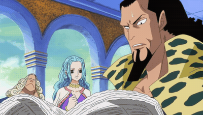 Bearded Man Reading Newspaper And Blue-Haired Woman GIF