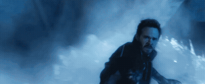 Bearded Man Running In Dark Room GIF