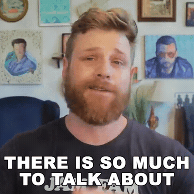 Bearded Man Saying There Is So Much To Talk About In Front Of Paintings GIF