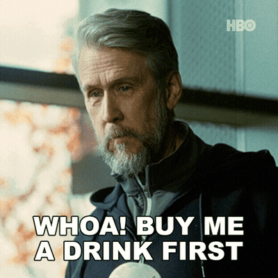 Bearded Man Saying Whoa Buy Me A Drink First Holding Cup GIF