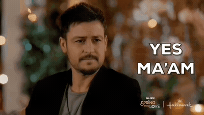 Bearded Man Saying Yes Ma'am In Front Of Christmas Tree GIF