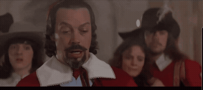 Bearded Man Saying You First To Another Man GIF