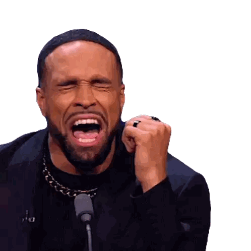 Bearded Man Screaming Into Microphone With Letter A Sticker