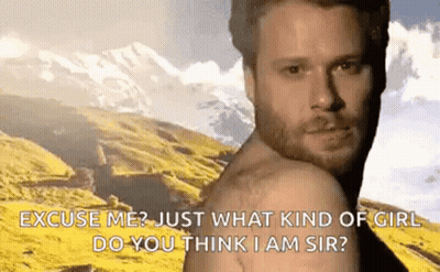 Bearded Man Shirtless In Front Of Mountains GIF
