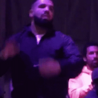 Bearded Man Singing In Dark Room GIF