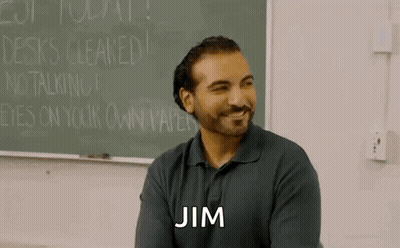 Bearded Man Sitting At Blackboard GIF