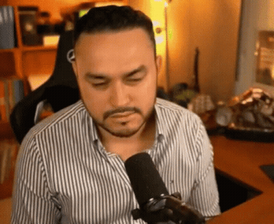 Bearded Man Sitting At Microphone GIF