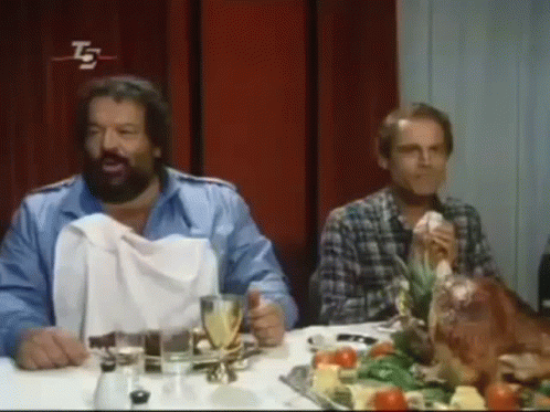 Bearded Man Sitting At Table With Turkey GIF