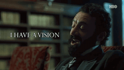 Bearded Man Sitting Before I Have A Vision Sign GIF