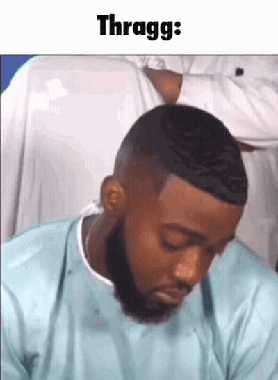 Bearded Man Sitting Eyes Closed Saying Thragg GIF