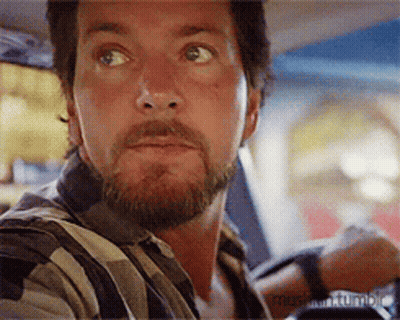Bearded Man Sitting In Car Looking At Something GIF